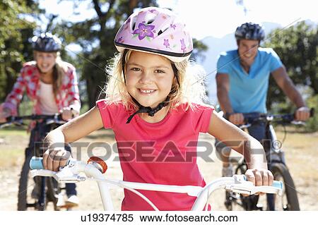 Young family on country bike ride View Large Photo Image Stock Photography - Young family on country bike ride. Fotosearch