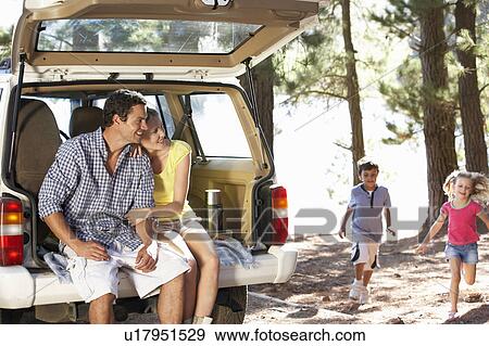 Stock Photo - Young family on day out in country. Fotosearch