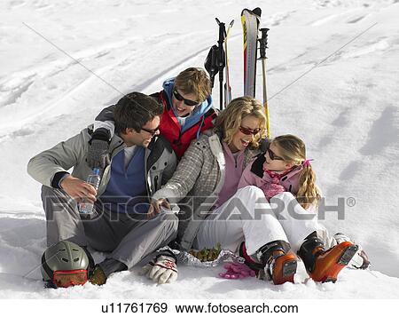 Stock Photo - Young Family On Ski Vacation. Fotosearch