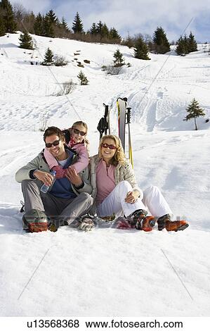 Stock Photo - Young Family On Ski Vacation. Fotosearch