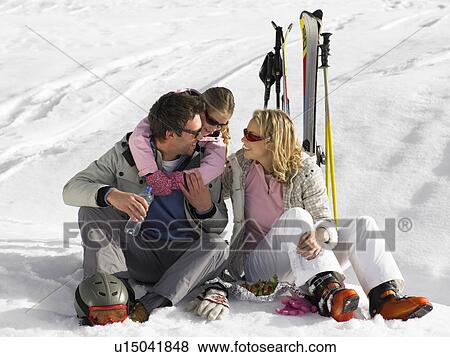 Stock Photo - Young Family On Ski Vacation. Fotosearch