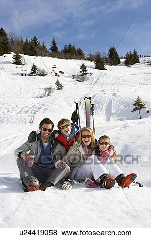 Stock Photo - Young Family On Ski Vacation. Fotosearch
