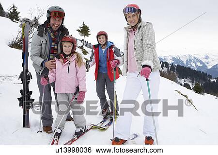 Stock Photograph - Young Family On Ski Vacation. Fotosearch