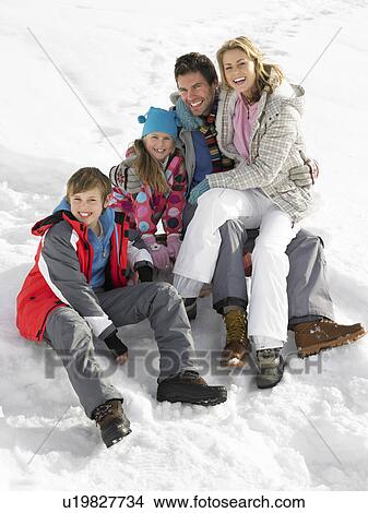 Young Family On Winter Vacation View Large Photo Image Picture - Young Family On Winter Vacation. Fotosearch