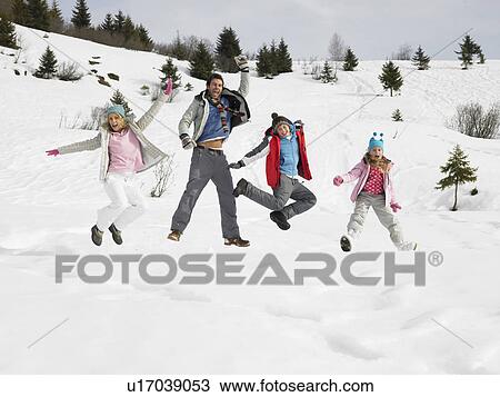 Stock Image - Young Family On Winter Vacation. Fotosearch