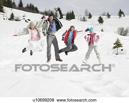 Stock Photo - Young Family On Winter Vacation. Fotosearch