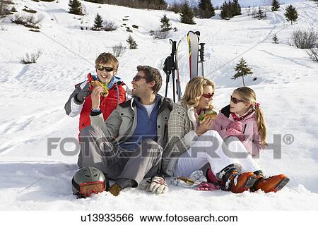 Young Family Sharing A Picnic On Ski Vacation View Large Photo Image Stock Photograph - Young Family Sharing A Picnic On Ski Vacation. Fotosearch