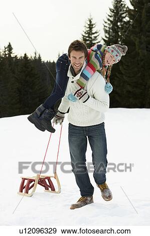 Young Father And Daughter In Snow With Sled View Large Photo Image Stock Photo - Young Father And Daughter In Snow With Sled. Fotosearch