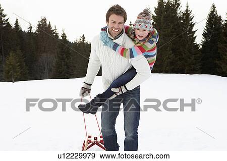 Young Father And Daughter In Snow With Sled View Large Photo Image Stock Photo - Young Father And Daughter In Snow With Sled. Fotosearch