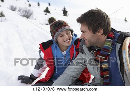 Stock Photo - Young Father And Son In Snowy Landscape. Fotosearch