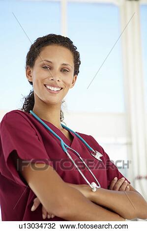 Stock Image - Young female doctor. Fotosearch
