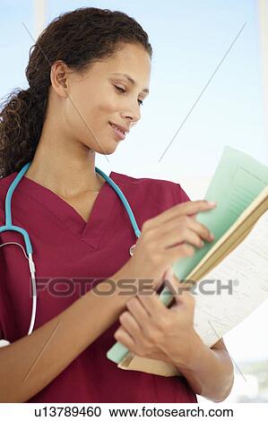 Stock Image - Young female doctor. Fotosearch