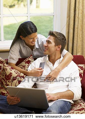 Young Hispanic couple shopping online View Large Photo Image Stock Image - Young Hispanic couple shopping online. Fotosearch