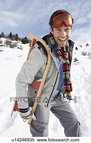 Young Man Carrying Sled In Alpine Landscape View Large Photo Image Stock Photography - Young Man Carrying Sled In Alpine Landscape. Fotosearch
