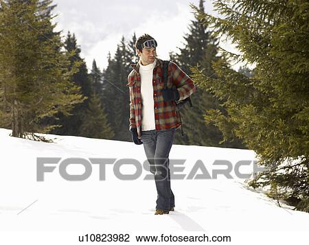 Stock Image - Young Man In Alpine Snow Scene. Fotosearch