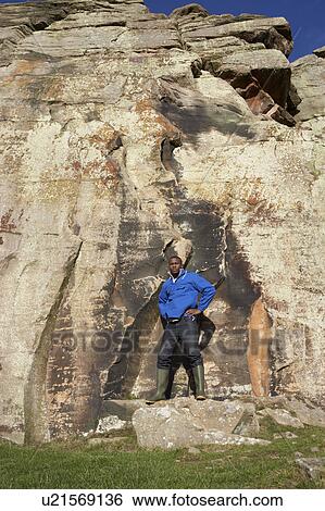Stock Photograph - Young man in countryside. Fotosearch