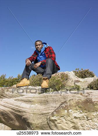 Stock Image - Young man in the country. Fotosearch