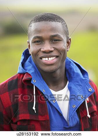 Stock Image - Young man in the country. Fotosearch