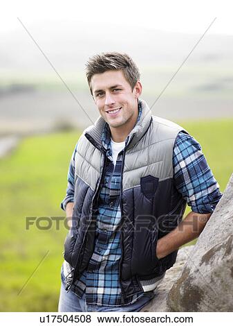 Stock Photo - Young man in the country. Fotosearch