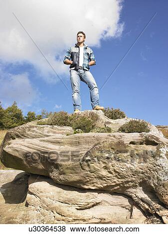 Stock Photo - Young man in the country. Fotosearch