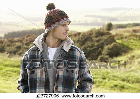 Stock Photograph - Young man in the country. Fotosearch