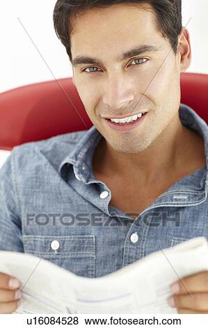 Stock Photo - Young man reading. Fotosearch