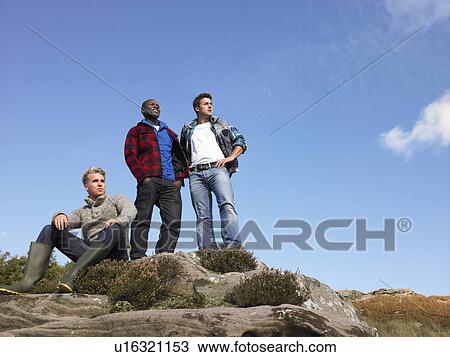 Stock Image - Young men in the country. Fotosearch