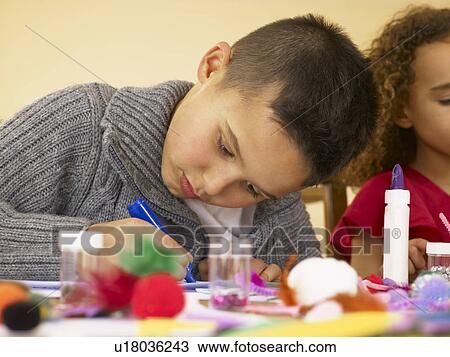 Young mixed race children doing handicrafts View Large Photo Image Stock Image - Young mixed race children doing handicrafts. Fotosearch