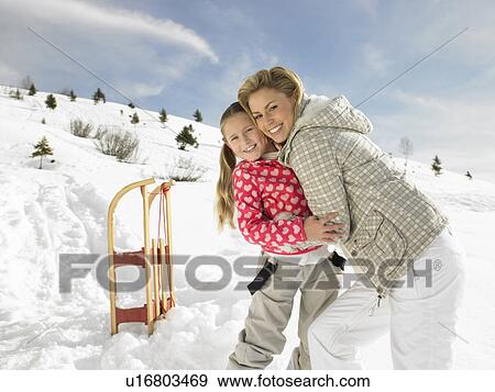 Young Mother And Daughter On Winter Vacation View Large Photo Image Stock Photo - Young Mother And Daughter On Winter Vacation. Fotosearch