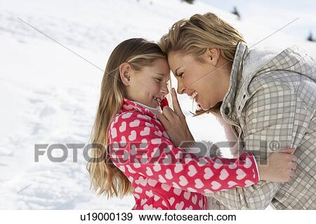 Stock Photo - Young Mother And Daughter On Winter Vacation. Fotosearch
