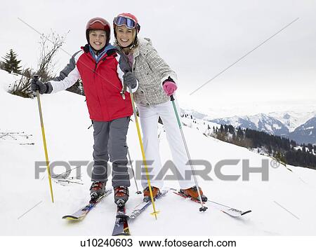 Stock Image - Young Mother And Son On Ski Vacation. Fotosearch