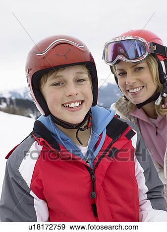 Stock Photo - Young Mother And Son On Ski Vacation. Fotosearch