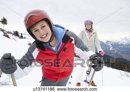 Stock Photograph - Young Mother And Son On Ski Vacation. Fotosearch