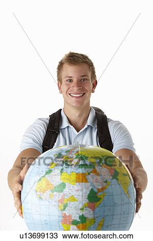 Stock Image - Young traveller with globe. Fotosearch