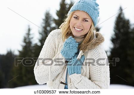 Stock Photo - Young Woman In Alpine Snow Scene. Fotosearch