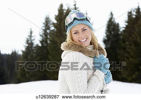 Stock Photo - Young Woman In Alpine Snow Scene. Fotosearch