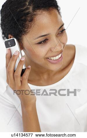 Stock Photo - Young woman on phone. Fotosearch