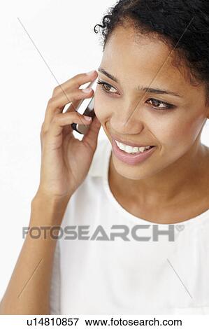 Stock Photo - Young woman on phone. Fotosearch