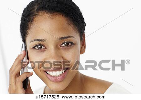 Young woman on phone View Large Photo Image Stock Photography - Young woman on phone. Fotosearch