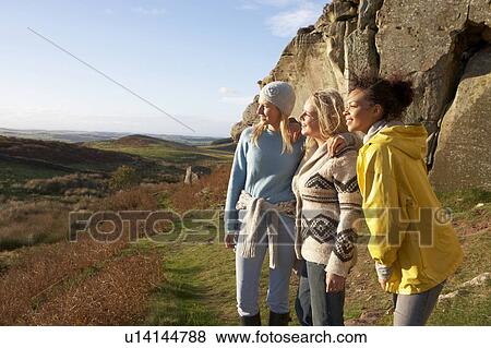 Young women on country walk View Large Photo Image Stock Photo - Young women on country walk. Fotosearch