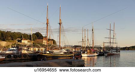Stock Photography - Boats at a harbor, Akershus Fortress, Oslofjord, Oslo, Norway. Fotosearch