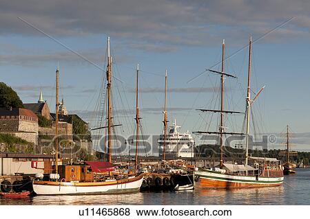 Boats at a harbor with the castle, Akershus Fortress, Oslofjord, Oslo, Norway View Large Photo Image Stock Photo - Boats at a harbor with the castle, Akershus Fortress, Oslofjord, Oslo, Norway. Fotosearch