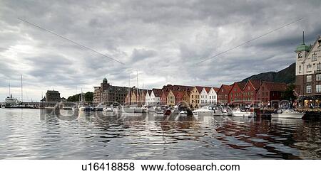 Stock Photo - Boats moored at a harbor, Bryggen, Bergen, Norway. Fotosearch