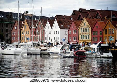 Stock Photography - Boats moored at a harbor, Bryggen, Bergen, Norway. Fotosearch