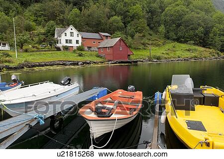 Stock Photo - Boats moored with houses in the background, Hardanger, Hardangerfjord, Hardangervidda, Hardanger, Norway. Fotosearch