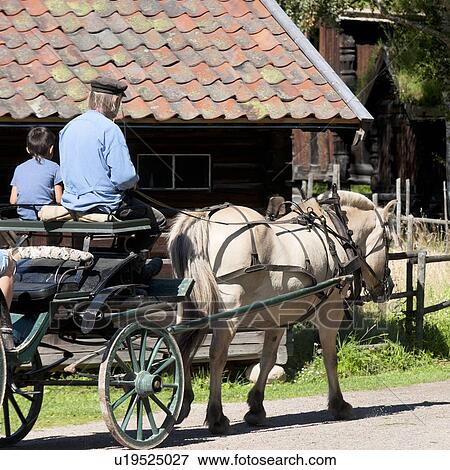 Boy sitting with a man in a horsedrawn, Norsk Folkemuseum, Oslo, Norway View Large Photo Image Stock Photo - Boy sitting with a man in a horsedrawn, Norsk Folkemuseum, Oslo, Norway. Fotosearch