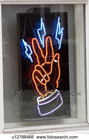 Stock Photograph - Close-up of a neon hand sign, Bergen, Norway. Fotosearch