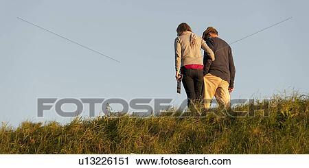 Couple walking on the grass, Akershus Fortress, Oslo, Norway View Large Photo Image Stock Image - Couple walking on the grass, Akershus Fortress, Oslo, Norway. Fotosearch