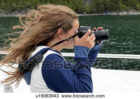 Girl taking picture from a boat, Norway View Large Photo Image Stock Image - Girl taking picture from a boat, Norway. Fotosearch