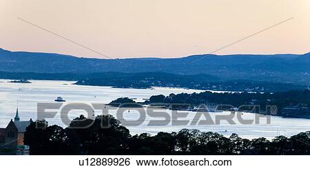 Stock Photograph - High angle view of bay at dusk, Oslofjord, Oslo, Norway. Fotosearch